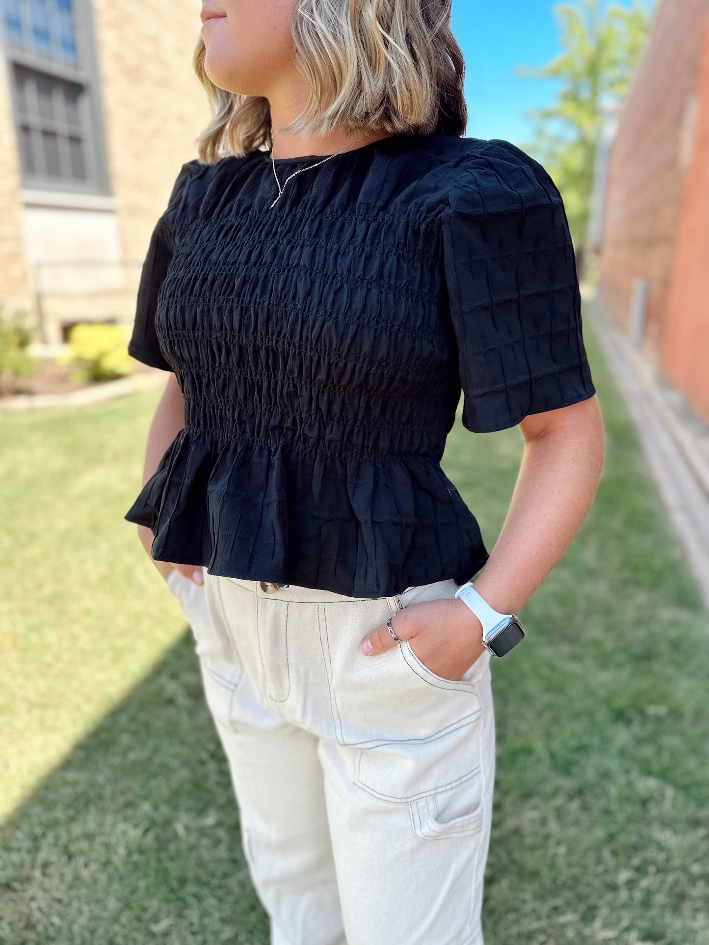 black smocked top