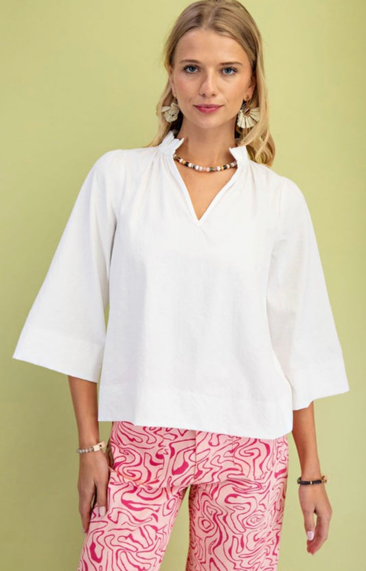 White ruffle neck blouse
